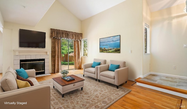830 Chardonnay Cir, Petaluma, CA 94954 - living room with high vaulted ceiling, wood finished floors, a tile fireplace, and baseboards