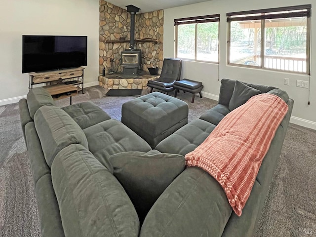 3320 Booth Way, Potter Valley, CA 95469 - carpeted living room featuring baseboards and a wood stove