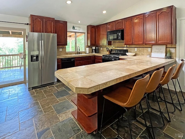 3320 Booth Way, Potter Valley, CA 95469 - kitchen with black appliances, backsplash, a peninsula, a sink, and stone tile flooring