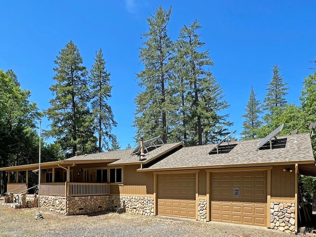3320 Booth Way, Potter Valley, CA 95469 - view of front of property featuring stone siding, roof with shingles, and a porch