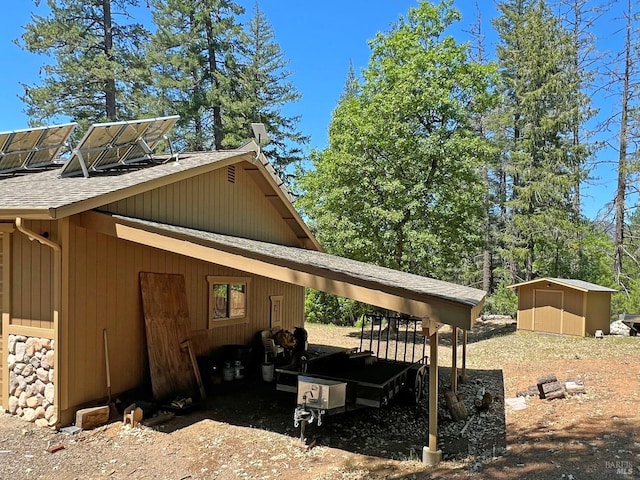 3320 Booth Way, Potter Valley, CA 95469 - view of side of property featuring roof with shingles, a shed, an outdoor structure, and a carport