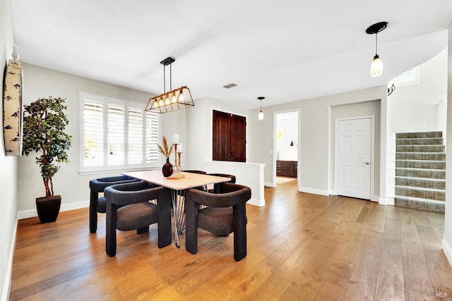 653 Robinson Way, Benicia, CA 94510 - dining area featuring stairway, light wood-style floors, and baseboards