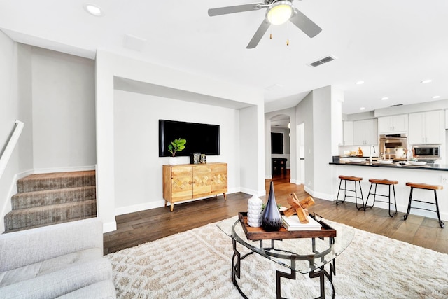 653 Robinson Way, Benicia, CA 94510 - living area with wood finished floors, arched walkways, stairs, recessed lighting, and ceiling fan