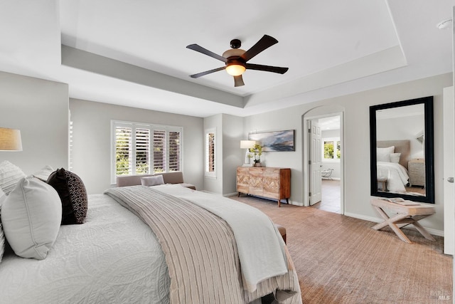 653 Robinson Way, Benicia, CA 94510 - carpeted bedroom with a raised ceiling, multiple windows, ceiling fan, and baseboards