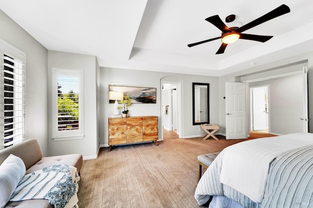 653 Robinson Way, Benicia, CA 94510 - bedroom with baseboards, a tray ceiling, ceiling fan, and light carpet