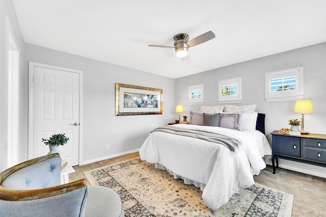 653 Robinson Way, Benicia, CA 94510 - bedroom featuring baseboards, light wood-type flooring, and a ceiling fan