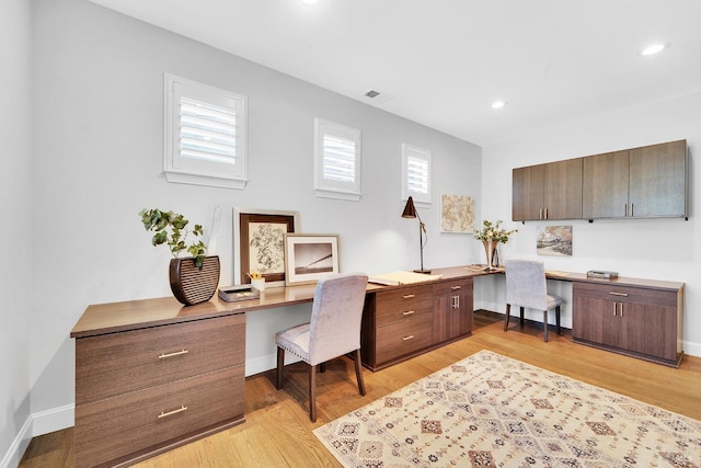 653 Robinson Way, Benicia, CA 94510 - office area with built in desk, plenty of natural light, light wood-style flooring, recessed lighting, and baseboards