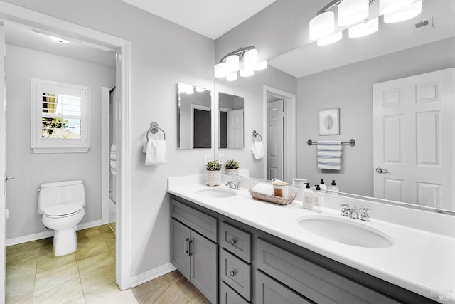 653 Robinson Way, Benicia, CA 94510 - bathroom with toilet, double vanity, baseboards, and washtub / shower combination