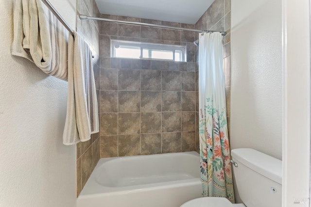 full bath with toilet and shower / bath combination with curtain