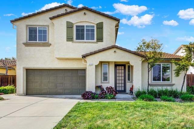 212 Via Del Sol, Vacaville, CA 95687 - mediterranean / spanish-style house featuring stucco siding, a tile roof, driveway, and an attached garage