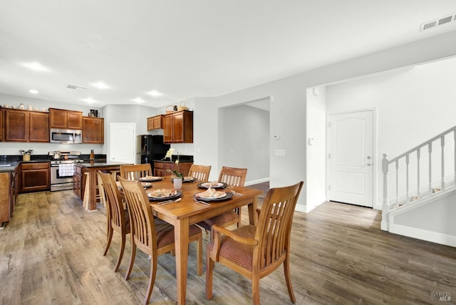 212 Via Del Sol, Vacaville, CA 95687 - dining room with wood finished floors, stairs, and baseboards