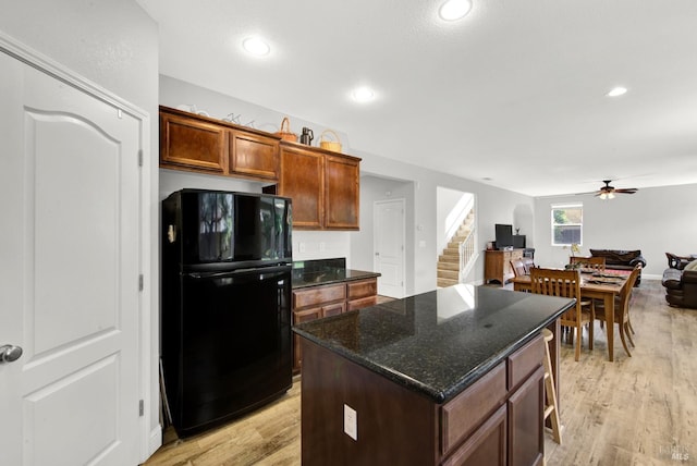 212 Via Del Sol, Vacaville, CA 95687 - kitchen with freestanding refrigerator, ceiling fan, light wood-style floors, open floor plan, and recessed lighting