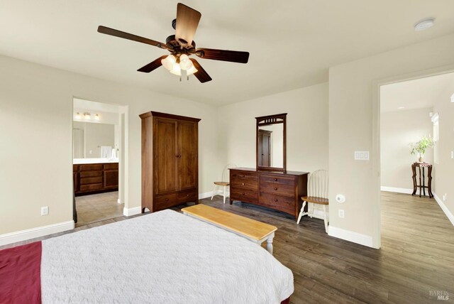212 Via Del Sol, Vacaville, CA 95687 - bedroom with baseboards, dark wood-style floors, ensuite bathroom, and ceiling fan