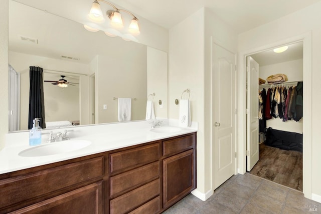212 Via Del Sol, Vacaville, CA 95687 - bathroom featuring double vanity, tile patterned flooring, ceiling fan, and a spacious closet