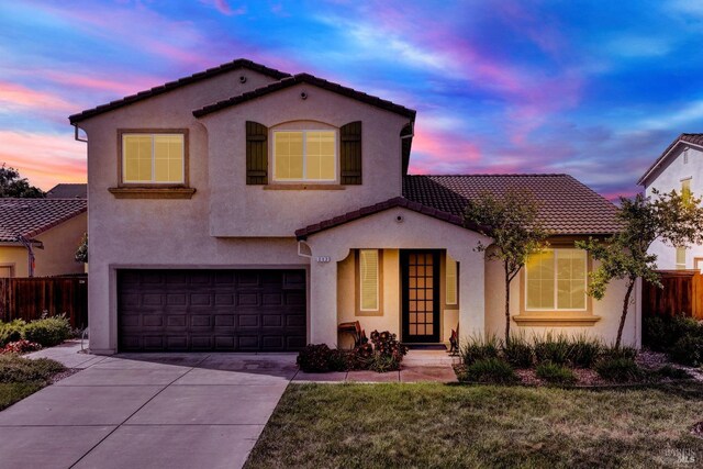 212 Via Del Sol, Vacaville, CA 95687 - mediterranean / spanish-style house featuring a tile roof, stucco siding, an attached garage, and driveway