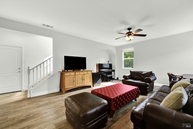 212 Via Del Sol, Vacaville, CA 95687 - living area featuring a ceiling fan, stairway, wood finished floors, and baseboards