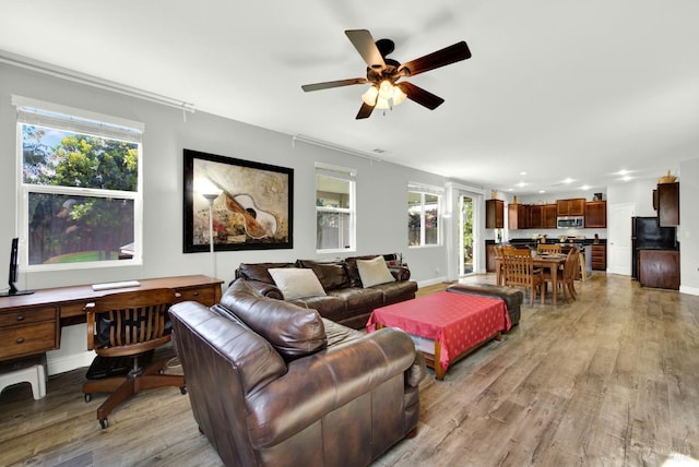 212 Via Del Sol, Vacaville, CA 95687 - living area featuring light wood finished floors, an office area, ceiling fan, baseboards, and recessed lighting