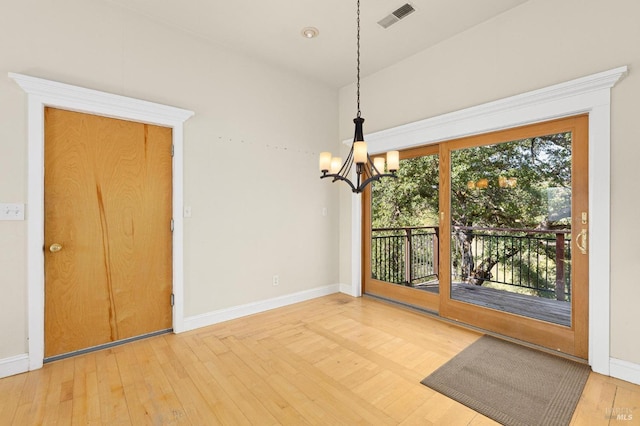 1126 Rimrock Dr, Napa, CA 94558 - unfurnished dining area with a chandelier, wood-type flooring, and baseboards