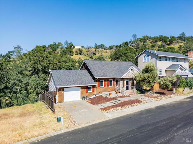 1126 Rimrock Dr, Napa, CA 94558 - view of front facade with concrete driveway, an attached garage, and a shingled roof