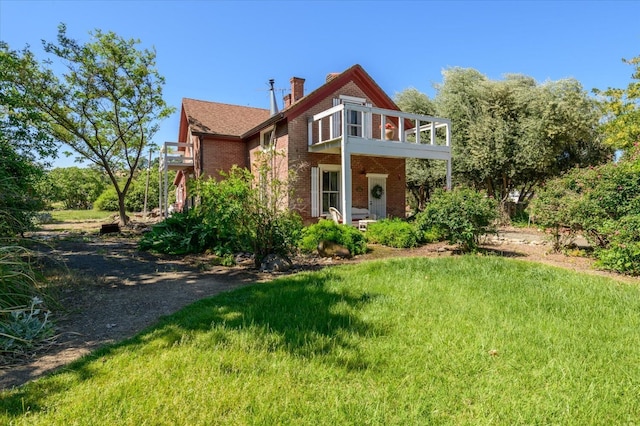 25107 Main St, Capay, CA 95607 - rear view of house with brick siding, a lawn, and a chimney