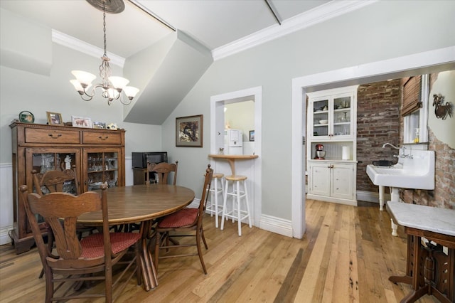 25107 Main St, Capay, CA 95607 - dining room featuring light wood-style floors, crown molding, a chandelier, and baseboards