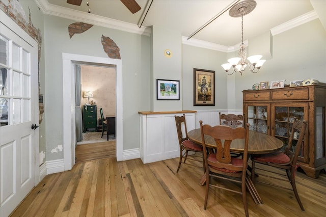 25107 Main St, Capay, CA 95607 - dining room with light wood-type flooring, ornamental molding, a chandelier, a ceiling fan, and baseboards