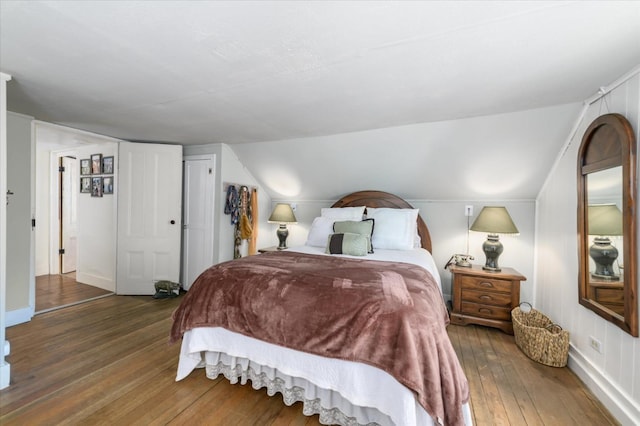 25107 Main St, Capay, CA 95607 - bedroom with wood-type flooring and vaulted ceiling
