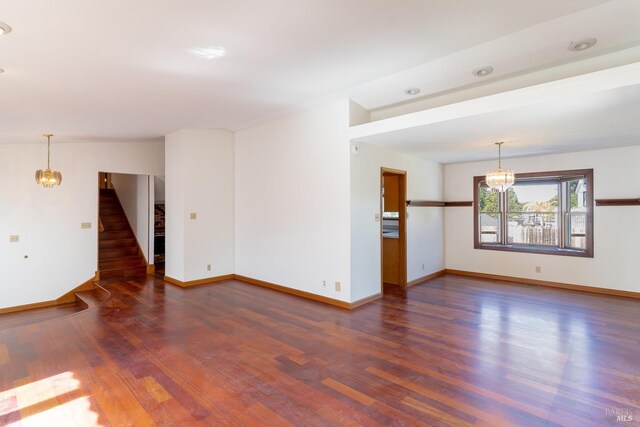 3756 Cano Ct, Napa, CA 94558 - spare room with a chandelier, stairway, wood finished floors, and baseboards