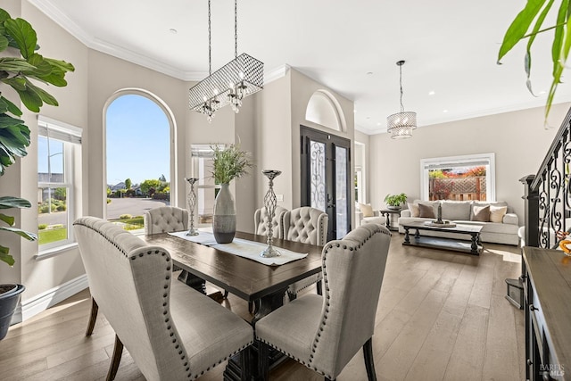 169 Pacific Heights Dr, Santa Rosa, CA 95403 - dining room featuring a chandelier, recessed lighting, wood-type flooring, crown molding, and baseboards