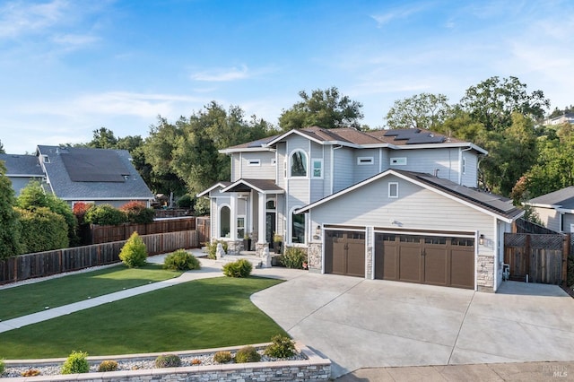 169 Pacific Heights Dr, Santa Rosa, CA 95403 - view of front of home with solar panels, an attached garage, concrete driveway, and stone siding
