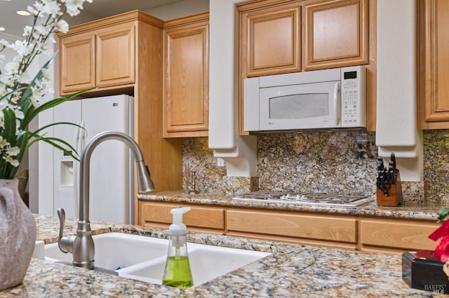 421 Redmont Ln, Rio Vista, CA 94571 - kitchen with white appliances, a sink, decorative backsplash, and light stone counters