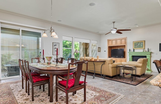 421 Redmont Ln, Rio Vista, CA 94571 - dining area featuring a ceiling fan, crown molding, a fireplace, and a chandelier