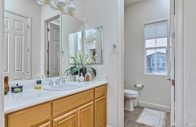 421 Redmont Ln, Rio Vista, CA 94571 - bathroom featuring toilet, vanity, and baseboards