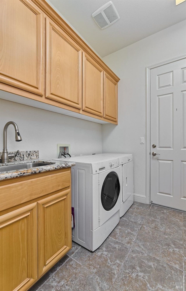 421 Redmont Ln, Rio Vista, CA 94571 - clothes washing area with cabinet space, washing machine and dryer, and baseboards