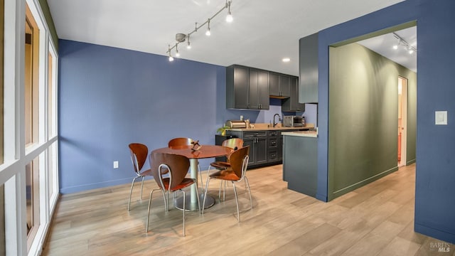 98 Forest Ln, San Rafael, CA 94903 - dining area with track lighting, light wood-style flooring, and baseboards