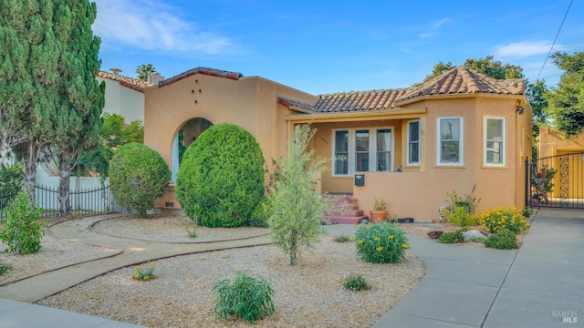 1302 Illinois St, Vallejo, CA 94590 - mediterranean / spanish home featuring stucco siding, fence, and a tiled roof