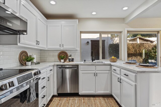 5258 El Mercado Pkwy, Santa Rosa, CA 95403 - kitchen with appliances with stainless steel finishes, a sink, white cabinets, decorative backsplash, and recessed lighting