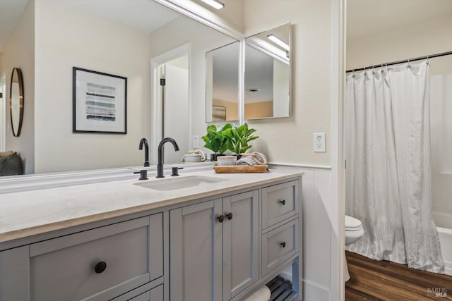 5258 El Mercado Pkwy, Santa Rosa, CA 95403 - bathroom with vanity, toilet, wainscoting, wood finished floors, and shower / bath combination with curtain