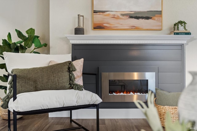 5258 El Mercado Pkwy, Santa Rosa, CA 95403 - sitting room featuring a glass covered fireplace and wood finished floors