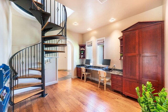 27681 Mace Blvd, Davis, CA 95618 - office space featuring built in desk, light wood-style floors, baseboards, and arched walkways