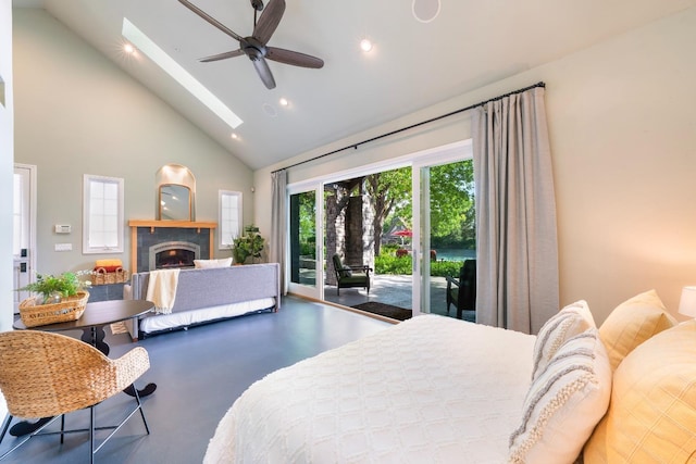 27681 Mace Blvd, Davis, CA 95618 - bedroom with access to exterior, a warm lit fireplace, high vaulted ceiling, a skylight, and recessed lighting