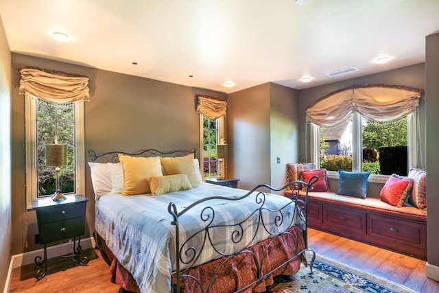 27681 Mace Blvd, Davis, CA 95618 - bedroom with multiple windows and light wood-type flooring