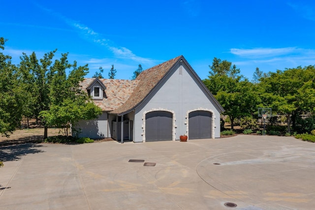 27681 Mace Blvd, Davis, CA 95618 - view of front of house featuring driveway, an attached garage, and stucco siding