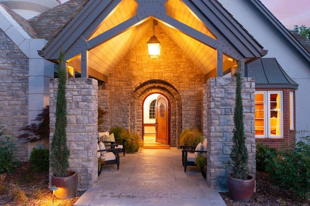 27681 Mace Blvd, Davis, CA 95618 - exterior entry at dusk featuring stone siding