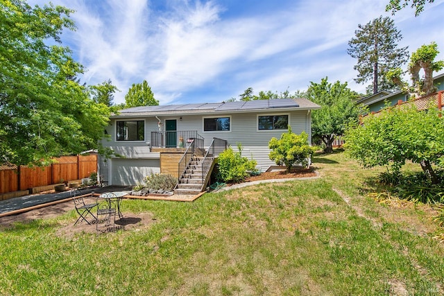 8940 Irving St, Graton, CA 95444 - back of property featuring solar panels, stairway, and an attached garage