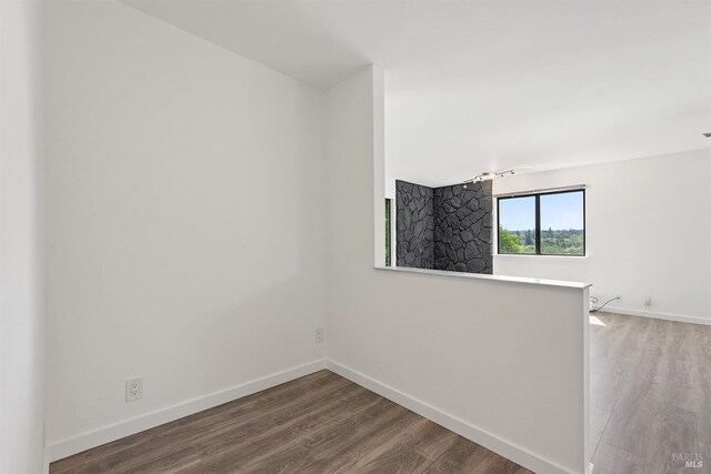 8940 Irving St, Graton, CA 95444 - corridor with light wood finished floors, rail lighting, and baseboards