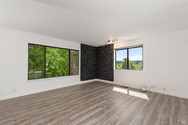 8940 Irving St, Graton, CA 95444 - unfurnished room with wood finished floors, baseboards, and a fireplace