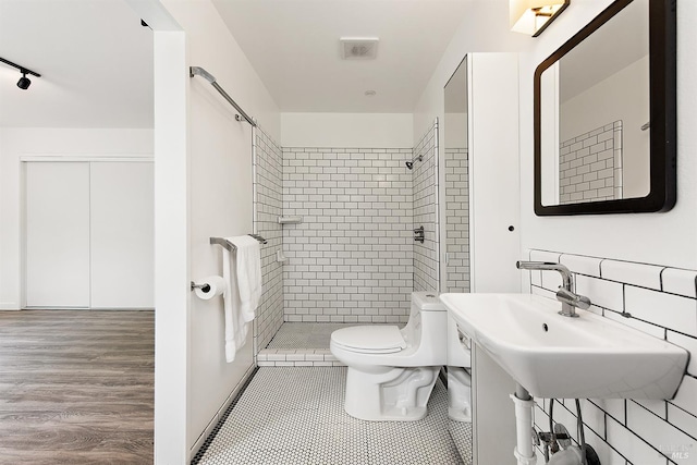 8940 Irving St, Graton, CA 95444 - full bathroom featuring a shower stall, toilet, and track lighting