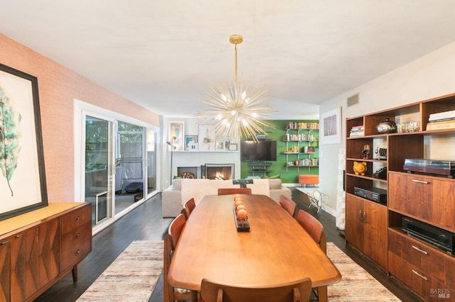 464 Azalea Way, Vacaville, CA 95688 - dining room with a chandelier, dark wood-type flooring, and a lit fireplace