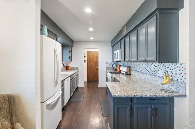 464 Azalea Way, Vacaville, CA 95688 - kitchen featuring white appliances, dark wood-type flooring, decorative backsplash, recessed lighting, and a sink